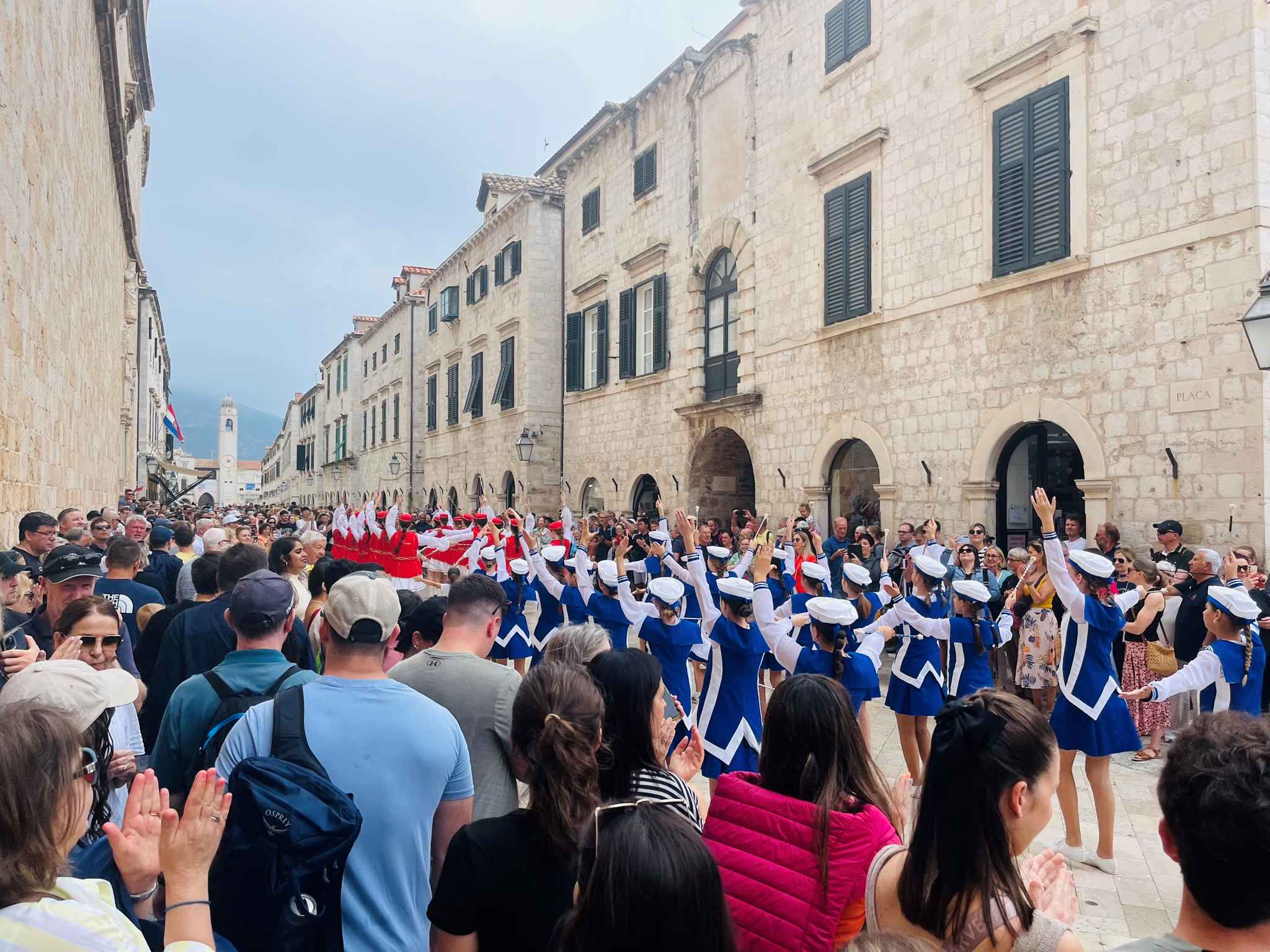 Huge crowds following a colorful band in Dubrovnik
